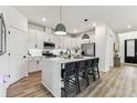 Stylish eat-in kitchen with island, pendant lights, and stainless appliances at 5117 Marina Basin Ct, Bradenton, FL 34211
