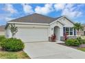 Well-maintained single-story home featuring a two-car garage, xeriscaping, and a welcoming front entrance at 5121 Sultana Cv, Bradenton, FL 34211