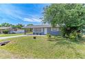 Landscaped front yard of a well-kept single-story home with a carport at 5710 16Th W St, Bradenton, FL 34207