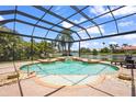 Relaxing screened-in pool with a beautiful lake view, perfect for enjoying the outdoors in privacy at 6143 9Th Avenue Ne Cir, Bradenton, FL 34212