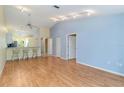 Spacious living room boasts vaulted ceilings and hardwood floors, flooded with natural light at 642 N Jefferson Ave # 13, Sarasota, FL 34237