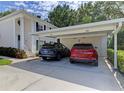 View of a covered carport with two parking spaces for units 104 and 204 at 802 Montrose Dr # 204, Venice, FL 34293