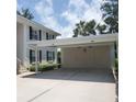 View of a covered carport with two storage spaces for units 104 and 204 at 802 Montrose Dr # 204, Venice, FL 34293
