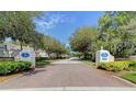 St. Andrews Park entrance featuring brick paved entry and manicured landscaping under a bright blue sky at 802 Montrose Dr # 204, Venice, FL 34293