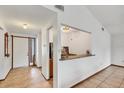A welcoming entryway with tile flooring and a view into the adjacent living space at 8160 Glenbrooke Ct, Sarasota, FL 34234