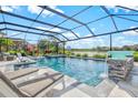 Stunning screened-in pool and spa with waterfall feature, perfect for relaxation and entertainment at 13112 Swiftwater Way, Bradenton, FL 34211