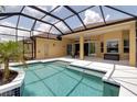 Inviting screened-in pool area with a sparkling pool, spacious deck, and covered patio at 1542 Ormond Ter, Parrish, FL 34219