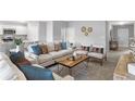 Bright living room featuring neutral furniture, an area rug, and large windows at 155 Swift St, Port Charlotte, FL 33954
