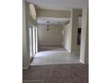 Open-concept foyer with tile flooring and a view of the formal dining area at 20316 Natures Corner Dr, Tampa, FL 33647