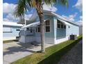 Charming light blue single-story home with well-maintained yard and white trim at 3333 26Th E Ave # 1132, Bradenton, FL 34208