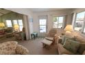 Cozy living room with comfortable seating, bright windows, and calming decor at 3333 26Th E Ave # 1132, Bradenton, FL 34208