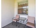 Relax on the patio with chairs and a table, perfect for enjoying the outdoors at 4103 Foristall Ave # 4103, Sarasota, FL 34233