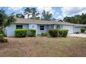 Charming single-story home with an attached two car garage and landscaped front yard at 4405 Linwood St, Sarasota, FL 34232