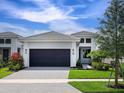Attractive single-story home boasts a spacious driveway, a two-car garage, and vibrant landscaping at 4927 Carova Way, Bradenton, FL 34211