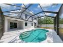 Inviting screened-in pool area, perfect for relaxation and entertainment with an attached covered patio at 5561 Burnt Branch Cir, Sarasota, FL 34232