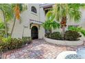 Elegant entrance with lush landscaping and a brick paved walkway leading to a charming, well-maintained home at 6101 34Th W St # 28E, Bradenton, FL 34210