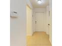 Bright hallway with tile flooring, leading to additional rooms within the home at 6101 34Th W St # 28E, Bradenton, FL 34210