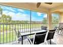 Screened balcony with golf course views and outdoor seating at 9620 Club South Cir # 5304, Sarasota, FL 34238