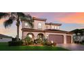 Stunning home with a well-manicured lawn and a welcoming front entrance at 13706 American Prairie Pl, Lakewood Ranch, FL 34211