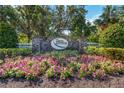 Attractive stone entrance sign with floral landscaping at Twin Rivers community entrance at 14314 17Th E Ct, Parrish, FL 34219