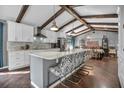 This spacious kitchen with white cabinets, an island, and marble countertops is perfect for entertaining at 1809 Buccaneer Ter, Sarasota, FL 34231