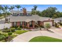 Attractive brick home with an attached two-car garage, well-kept lawn, and ample landscaping at 1904 Nw 79Th St, Bradenton, FL 34209