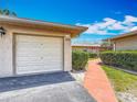 View of the detached garage with easy access to the charming walkway at 2188 Corinne S Ct # A, St Petersburg, FL 33712
