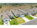 Aerial view showcasing the property's layout, landscaping, and position within a quiet neighborhood at 2926 61St E Dr, Ellenton, FL 34222