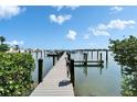 Community dock with waterfront views and boat access at 3540 Gulf Of Mexico Dr # 303, Longboat Key, FL 34228