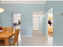 Bright interior featuring tile flooring, an open layout, and views into the kitchen and bedroom at 3627 Longmeadow # 39, Sarasota, FL 34235