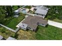Aerial view of a home with a fenced backyard and swimming pool at 417 20Th W Ave, Palmetto, FL 34221