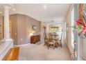 Elegant dining room featuring a wooden table with seating for six, a vintage buffet, and soft, neutral decor at 4322 Reflections Pkwy, Sarasota, FL 34233