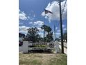 Burgundy Condominiums entrance sign with American flag on a sunny day at 4511 3Rd Street W Cir # 289, Bradenton, FL 34207