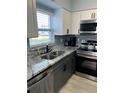 Updated kitchen with stainless steel appliances, granite countertops and plenty of storage space at 4511 3Rd Street W Cir # 289, Bradenton, FL 34207