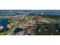 Aerial view of community highlighting waterways, golf course, and nearby bridges at 6151 Bahia Del Mar Blvd # 123, St Petersburg, FL 33715