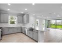 Spacious kitchen with stainless steel appliances and a large island at 16234 Isola Pl, Bradenton, FL 34211