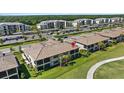 Scenic aerial view of the community with lush landscaping and convenient parking at 18113 Gawthrop Drive # 101, Lakewood Ranch, FL 34211