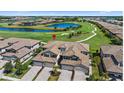 Scenic aerial view of the neighborhood and golf course with lush landscaping at 18113 Gawthrop Drive # 101, Lakewood Ranch, FL 34211