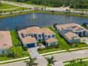 An aerial view shows this pristine, two-story home that sits on a manicured lawn in a well-kept community at 18215 Cayo Largo Pl, Bradenton, FL 34202