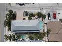 Bird's eye view of a stunning backyard pool, hot tub, and lush tropical landscaping at 220 36Th St, Holmes Beach, FL 34217