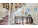 Foyer features a decorative table, beautiful staircase, and elegant accents at 220 36Th St, Holmes Beach, FL 34217