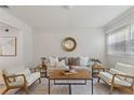 Bright and airy living room with seating and lots of natural light from the windows at 2507 Beneva Rd # 2, Sarasota, FL 34232