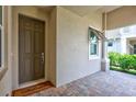 Inviting front entrance featuring a stylish door, covered porch, and a 