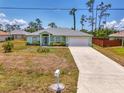 Charming single-story home featuring well-maintained landscaping and a spacious driveway at 2759 Starview Ave, North Port, FL 34288