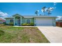 Charming single-story home with well-maintained lawn, landscaping and spacious driveway at 2759 Starview Ave, North Port, FL 34288