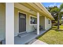 Inviting front porch with seating, offering a relaxing outdoor space at the home's entrance at 3102 16Th W Ave, Bradenton, FL 34205