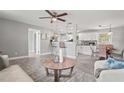Open-concept living room featuring modern decor and seamless transition to the kitchen at 3102 16Th W Ave, Bradenton, FL 34205