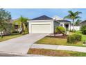 Inviting single-story home with a well-kept lawn and driveway, showcasing its curb appeal at 4315 Deep Creek Ter, Parrish, FL 34219