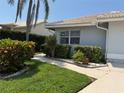 Landscaped front yard with lush greenery, and well-manicured bushes at 4613 Muirfield Dr, Bradenton, FL 34210