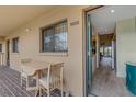 Charming patio with table and chairs, adjacent to the unit's entrance, offering a cozy outdoor space at 5632 Ashton Lake Dr # 5632, Sarasota, FL 34231